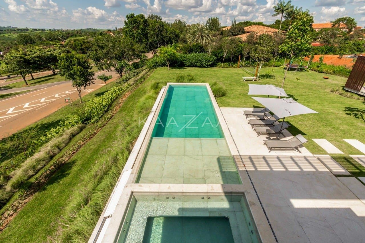 Casa contemporânea feita para interagir com a natureza ao redor. Projeto na Quinta da Baroneza. - Foto 42